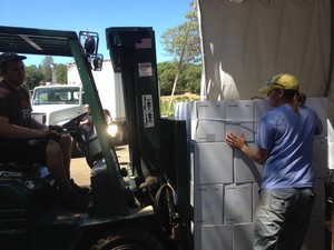 loading a pallet of wine on a forklift